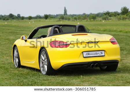 A sports car Porche BOXTER S, YELLOW. Shot on private airport Hertelendy, 26 June 2012, Hungary