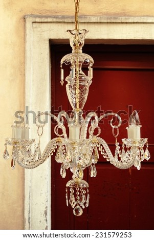 crystal chandelier at the flea market on the doors background/crystal chandelier