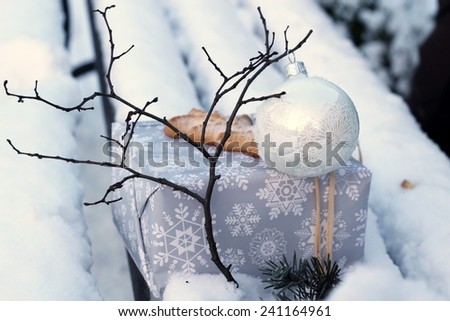 gift on snow covered bench /gift on snow covered bench