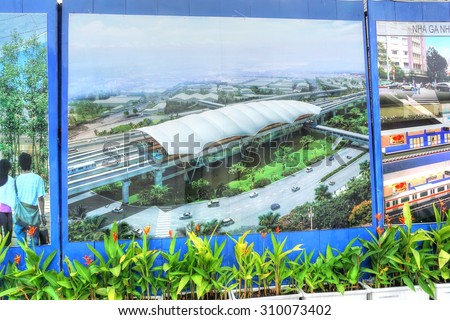 Saigon, Ho Chi Minh city, Vietnam, August 10, 2015 : Construction site of the new FIRST subway, metro line Saigon. Public display of giant images of the finished project and final metro line 1 map