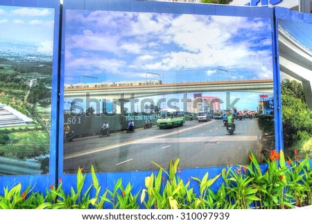 Saigon, Ho Chi Minh city, Vietnam, August 10, 2015 : Construction site of the new FIRST subway, metro line in the heart of Saigon. Public display of giant images of the finished project.