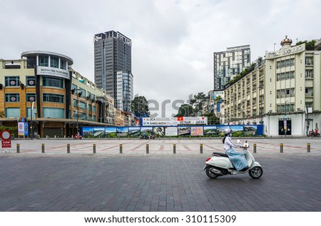Saigon, Ho Chi Minh city, Vietnam, August 10, 2015 : Construction site of the new FIRST subway, metro line in Saigon. Last image of the Saigon Tax Center building on the left, it will be demolished.