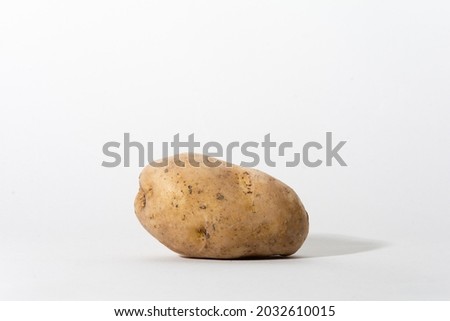 Raw yellow potato on white background. Potato  for frying. Potato recipes. One of the important agricultural products of Turkey. Best vegetables from market or bazaar.
