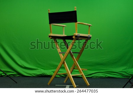 Director\'s chair in front of green screen