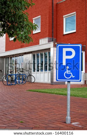 Parking sign for the disabled in front of a public office building
