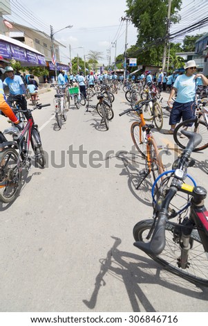 UTHAI THANI,THAILAND-AUGUST 16,2015 : Unidentified Cyclist and people in\