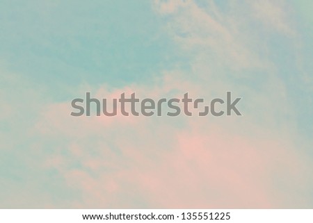 Light blue sky with pink clouds