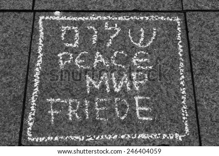 Leipzig, Germany - January 21: Chalk drawing stating peace in several languages. Drawings like these were all over Augustus Platz during \'Anti-Pegida\' protests on January 21, 2015 in Leipzig, Germany