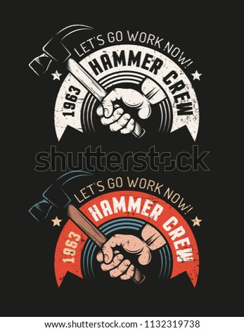 Hand holding  hammer and heraldic ribbon with the inscription - workshop retro logo on a black background. Color and monochrome versions. Grunge worn texture on separate layer and easily turn off.