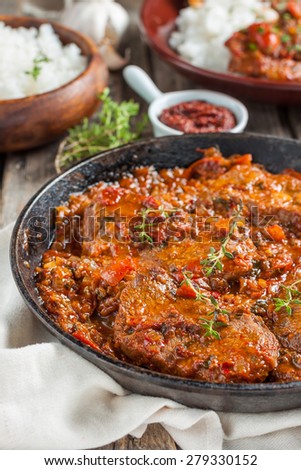 beef in a spicy tomato sauce with rice