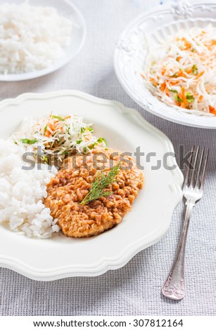 pork chop with rice and coleslaw