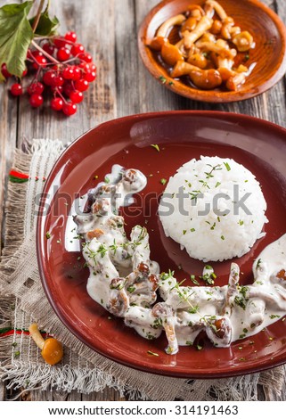 Beef Stroganoff with mushrooms and rice. Russian kitchen