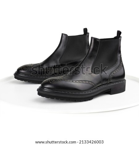 Black brogue chelsea boots on a white background ストックフォト © 