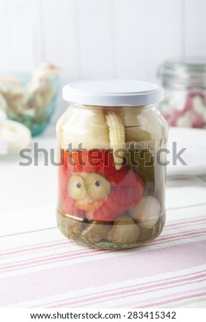 Jar of mixed pickles on kitchen table