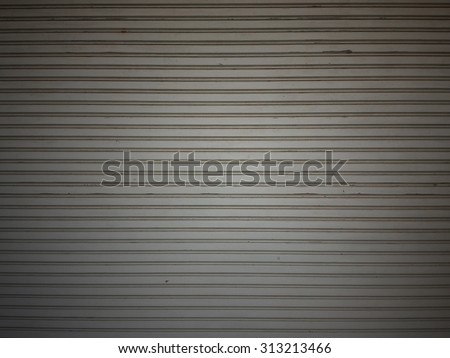 grunge metallic roller shutter door. shutter steel door texture