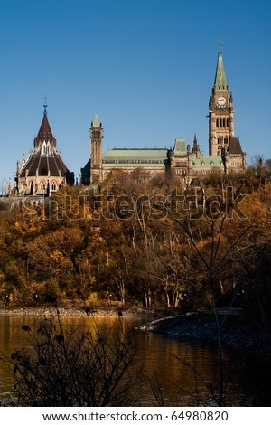 East facing side of Parliament Hill and the Canadian Parliament Buildings in Autumn with Library of Parliament visible - Ottawa, Ontario Canada.