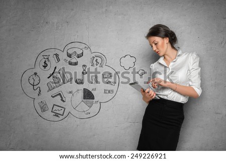 Young pretty woman in office cloth with tablet on concrete wall background with business sketches