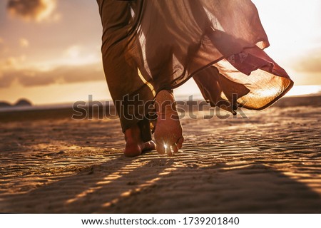 Similar – Image, Stock Photo Young female walking barefoot on wet sand