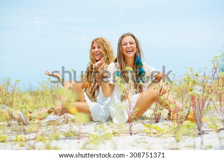 Two smiling girls friends outdoors