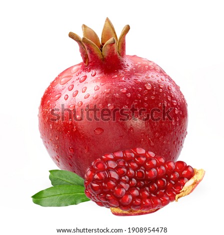 Pomegranate with slice and leaves isolated white background
