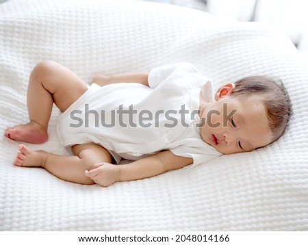 Similar – Image, Stock Photo 3 month old baby doing tummy time; bohemian interior room with houseplants