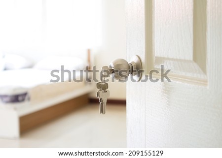 opened bedroom door with the key