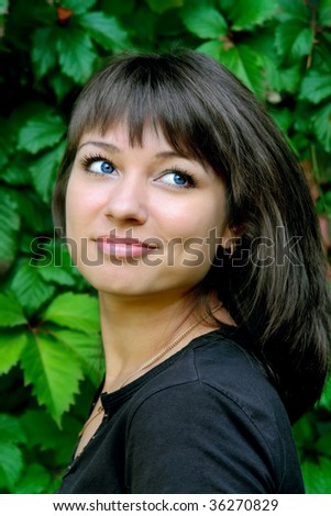 smiling young beauty brunette with dark blue eyes
