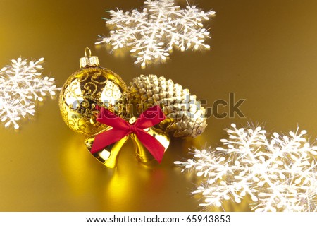 New Year\'s ornaments are removed on a golden background.