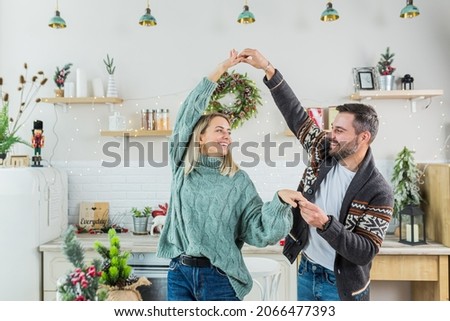 Similar – Image, Stock Photo Young woman in christmassy clothes looks smiling at a christmas present