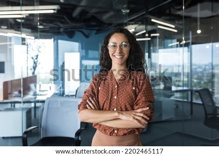 Similar – Image, Stock Photo Woman young looking at smartphone sitting on a beach rock