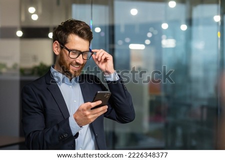 Similar – Image, Stock Photo Man with beard and plaid shirt of aesthetic lumberjack spreads his arms in the middle of nature with joy