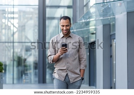 Similar – Image, Stock Photo Islamic man using smartphone on street