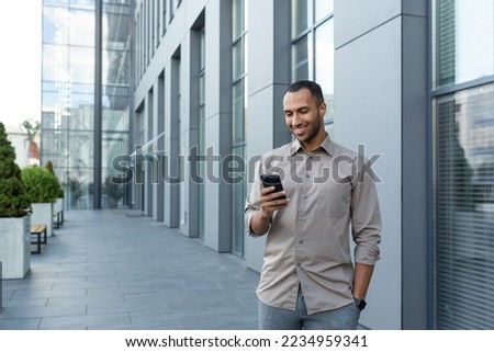 Image, Stock Photo Islamic man using smartphone on street