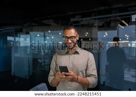 Similar – Image, Stock Photo Man browsing smartphone in office