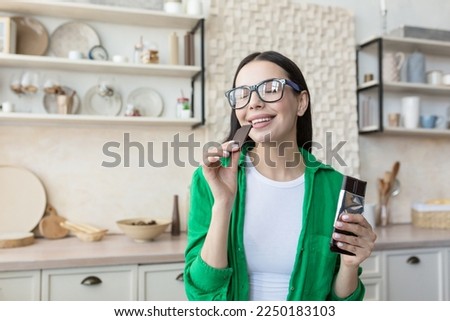 Similar – Image, Stock Photo Black woman eating candy