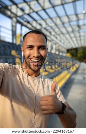 Similar – Image, Stock Photo Ethnic sportsman in headphones getting ready for running