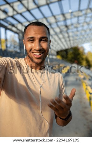 Similar – Image, Stock Photo Ethnic sportsman in headphones getting ready for running