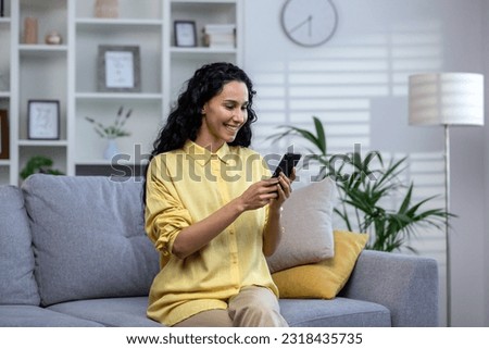 Similar – Image, Stock Photo young latin woman sitting alone home office working on a laptop and listening to music on earphones, Mexican girl in Mexico working at home
