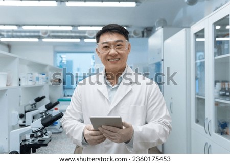 Similar – Image, Stock Photo Young researcher with protective goggles checking test tubes