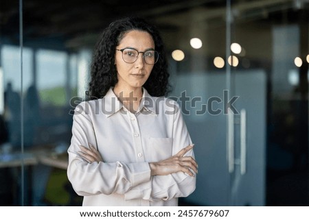 Similar – Image, Stock Photo Serious woman looking at camera