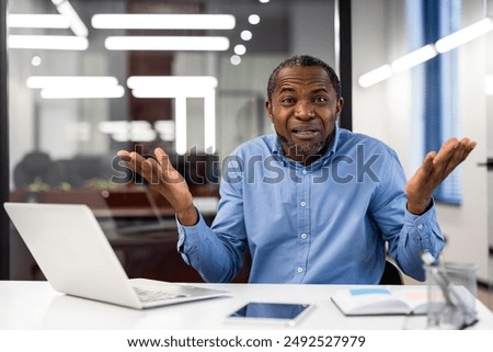 Similar – Image, Stock Photo Puzzled senior businessman in stylish formal wear at shopping plaza