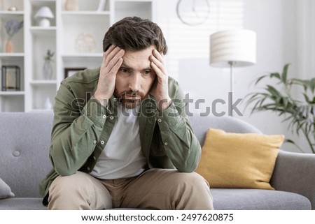 Similar – Image, Stock Photo adult man reflecting on his future