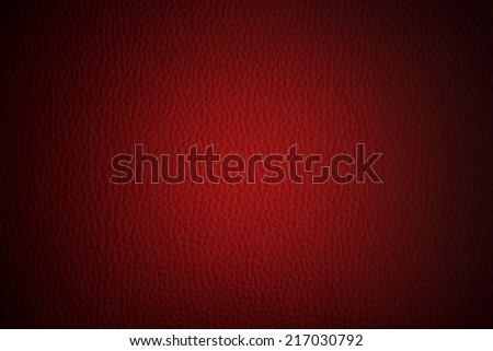 red leather texture or background with black vignette borders