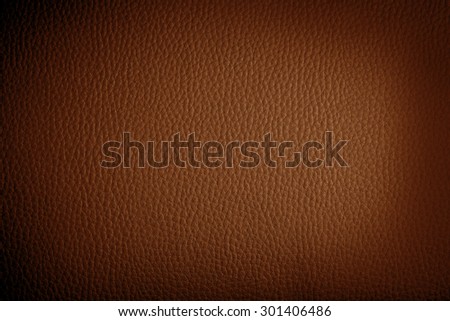 orange leather background or texture with dark vignette borders