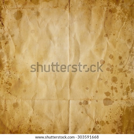 old crumpled paper texture or background with coffee stains