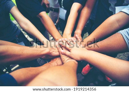 Solidarity unite people hands together community teamwork. Hands of spirit team working together outdoor. Unity strong handshake with people or agreement of feeling or happy diverse education action