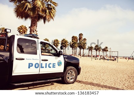 LOS ANGELES, USA - JULY 24: Police car on Santa Monica State Beach on July 24, 2012 in Santa Monica, California. Santa Monica has 3.5 miles of well-maintained California beach locations