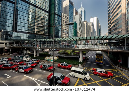 HONG KONG, CHINA - DECEMBER 23, 2013: City train rails and traffic on Hong Kong Island on December 23, 2013 in Hong Kong, China.
