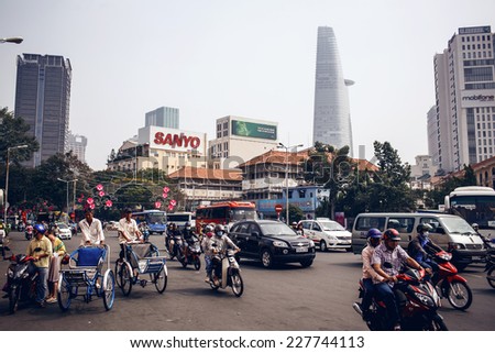 SAIGON - DECEMBER 28: Road traffic in Saigon, Vietnam on December 28,2013. In the biggest city in Southern Vietnam are more than 4 mil. motorbikes, the traffic is often congested.