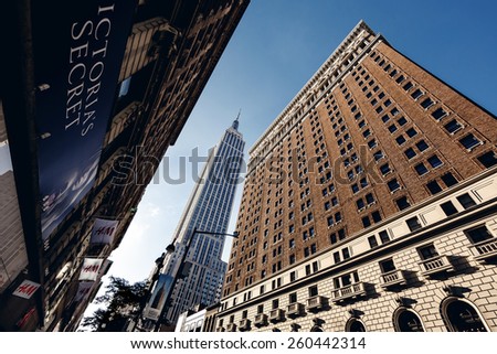 NEW YORK, UNITED STATES - SEPTEMBER 10: Typical below view from street on famous skyscrapers on September 10, 2014 in New York, USA